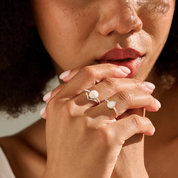 Model wearing handmade breastmilk jewellery rings UK.