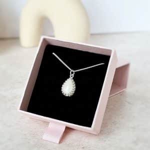 breastmilk crown teardrop necklace in silver close up